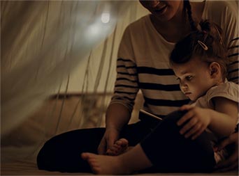 mom reading to child